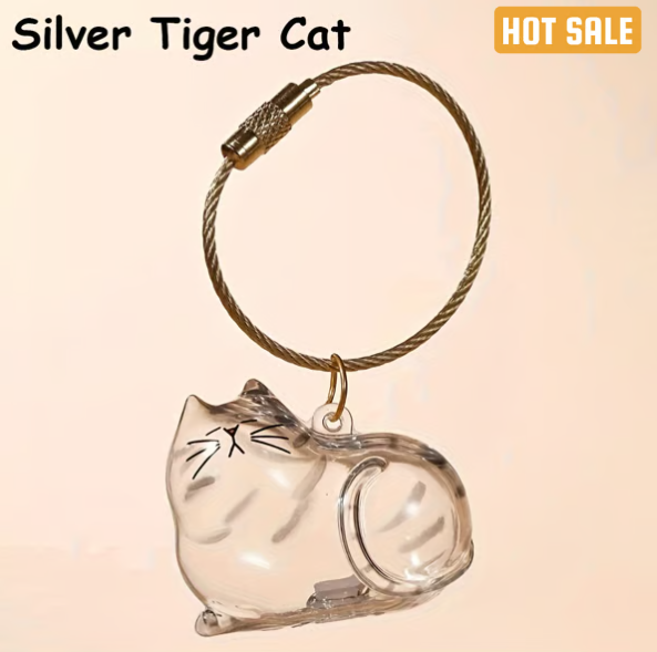 Pet Hair Memorial Capsule Keychain by CC+Tea, showing a small glass capsule with pet hair inside attached to a keyring.