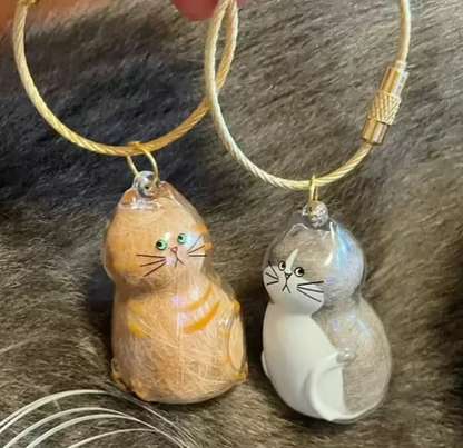 Pet Hair Memorial Capsule Keychain by CC+Tea, small silver keychain with a clear capsule for pet hair keepsake.