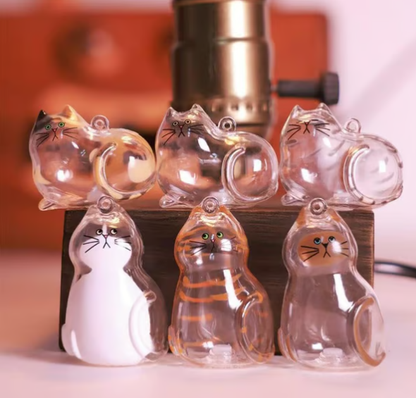 CC+Tea pet hair memorial capsule keychain featuring a small, transparent capsule with pet hair inside and a metal keyring attachment.